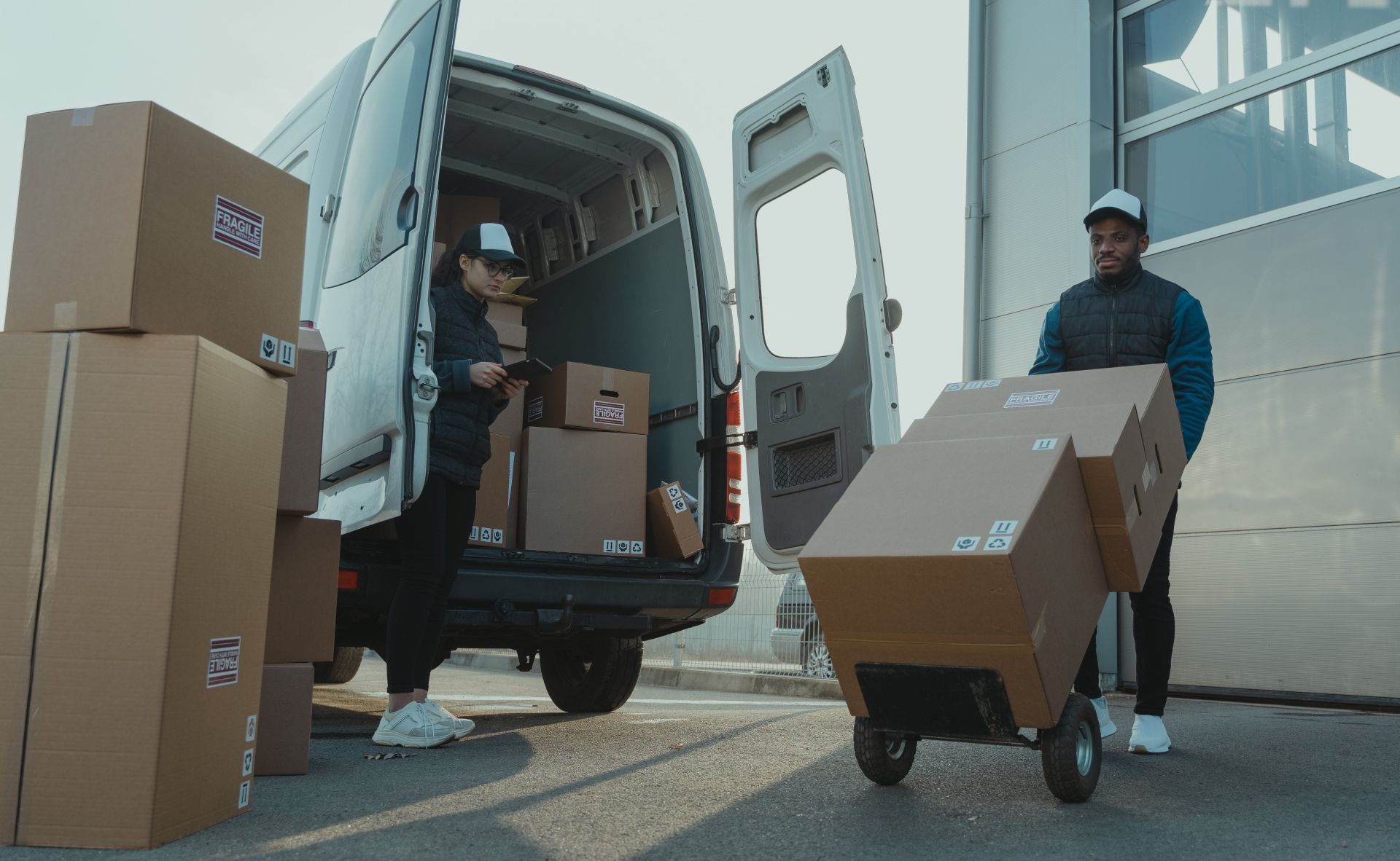 A Man and a Woman Working for a Delivery Company