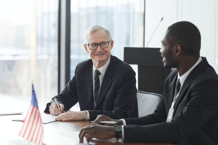 Two Men in Business Suits Looking at Each Other